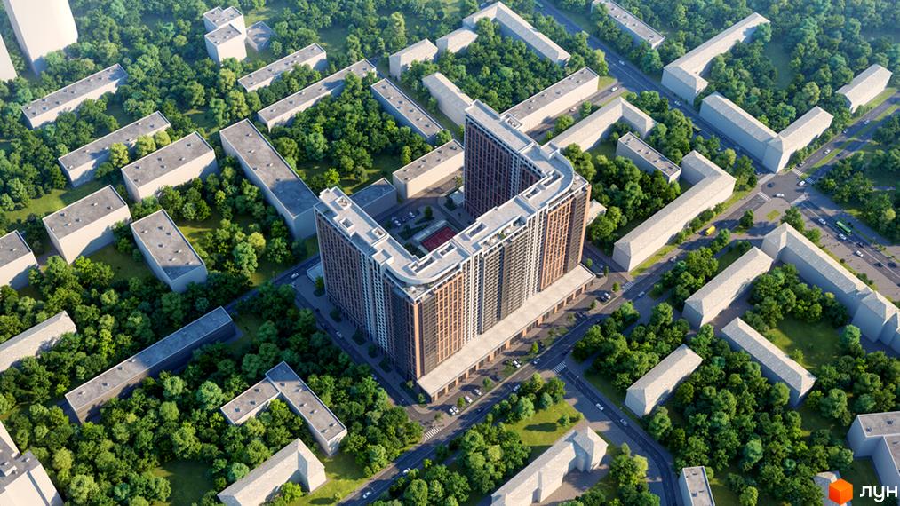 Висотна будівля ЖК Оскар у формі літери U, навколо якої розташовані будинки меншої поверховості та зелені насадження. На території комплексу є парковка та дитячий майданчик.