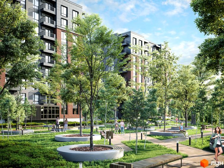 Комплекс West Towers з цегляним та сірим фасадом, оточений зеленим парком з деревами та місцями для відпочинку.