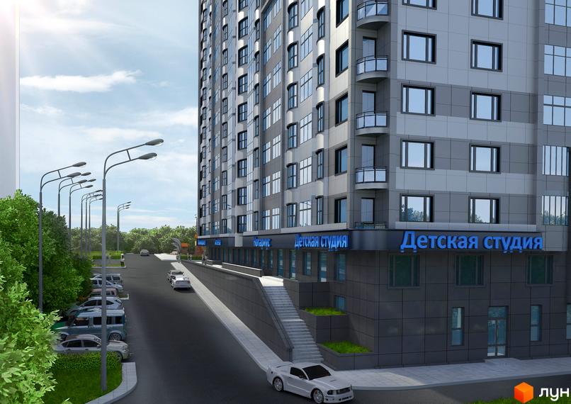 Житловий комплекс Статус Град з сірими фасадами та блакитними балконами. Навколо будинку розташовані зелені насадження та місця для паркування автомобілів.