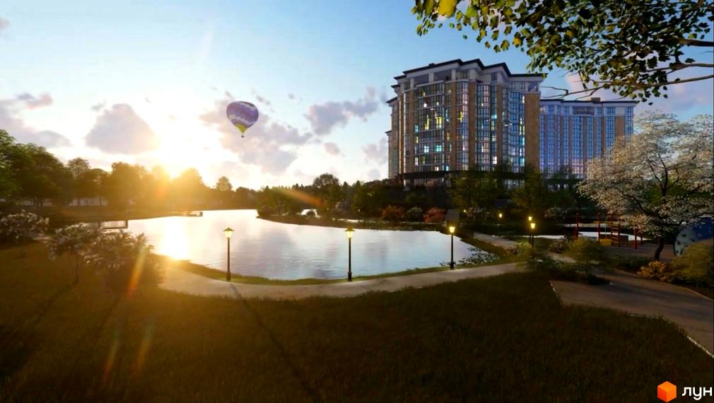 Зображення Житлового комплексу Оселя Парк з виглядом на будівлі та прибудинкову територію з озером і парком.