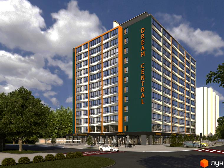 Житловий комплекс Dream Central: багатоповерховий будинок з великими вікнами та фасадом зеленого кольору. Навколо будівлі розташована прибудинкова територія з деревами та парковкою.