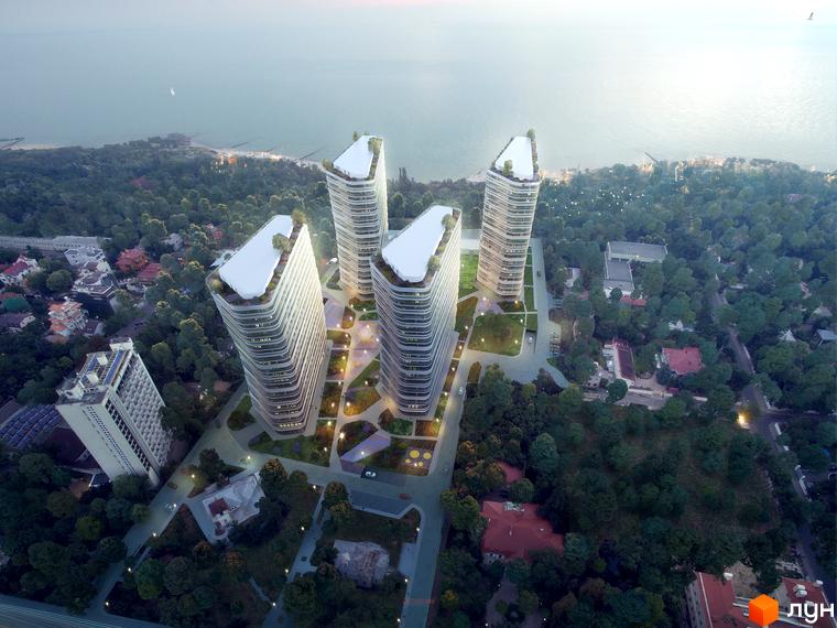 Високоповерхова новобудова Kandinsky Odesa Residence з білими фасадами та терасами на даху. Навколо комплексу розташована зелена прибудинкова територія з алеями та деревами.