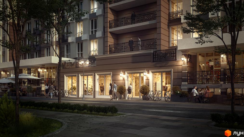 Зовнішній вигляд новобудови ЖК Благород ввечері. На фасаді будинку розташовані балкони з кованими огорожами, а на першому поверсі – вітрини магазинів. Біля будинку облаштована пішохідна зона з деревами та місцями для відпочинку.