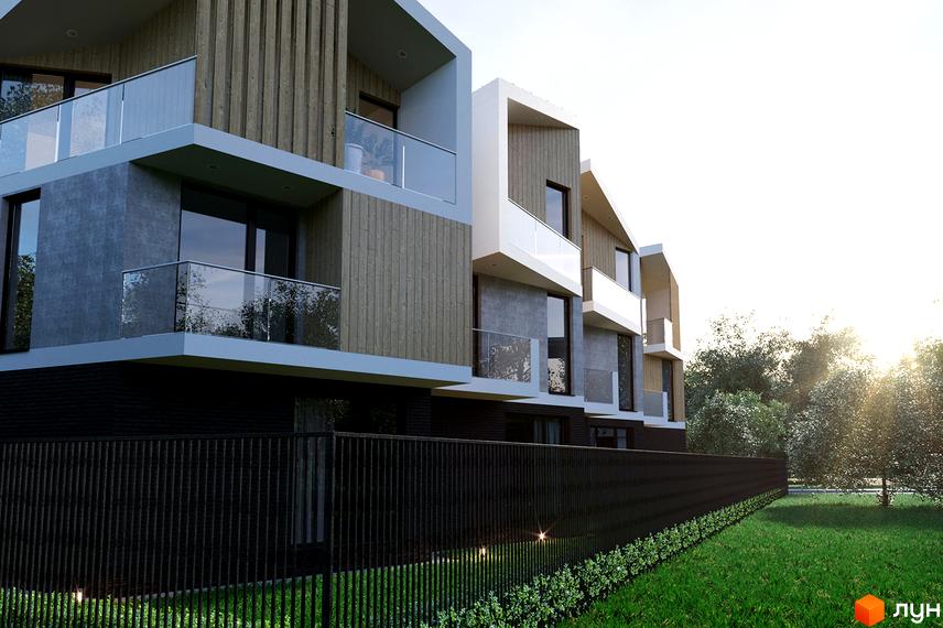 Триповерхові будинки з дерев'яними панелями та скляними балконами. Перед будинками низький чорний паркан та зелена галявина з рослинами.
