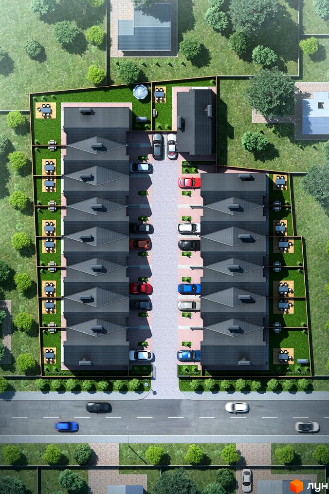 Вигляд зверху на Котеджне містечко Oscar з будинками з сірими дахами та зеленими подвір'ями. Навколо багато дерев та припарковані авто.