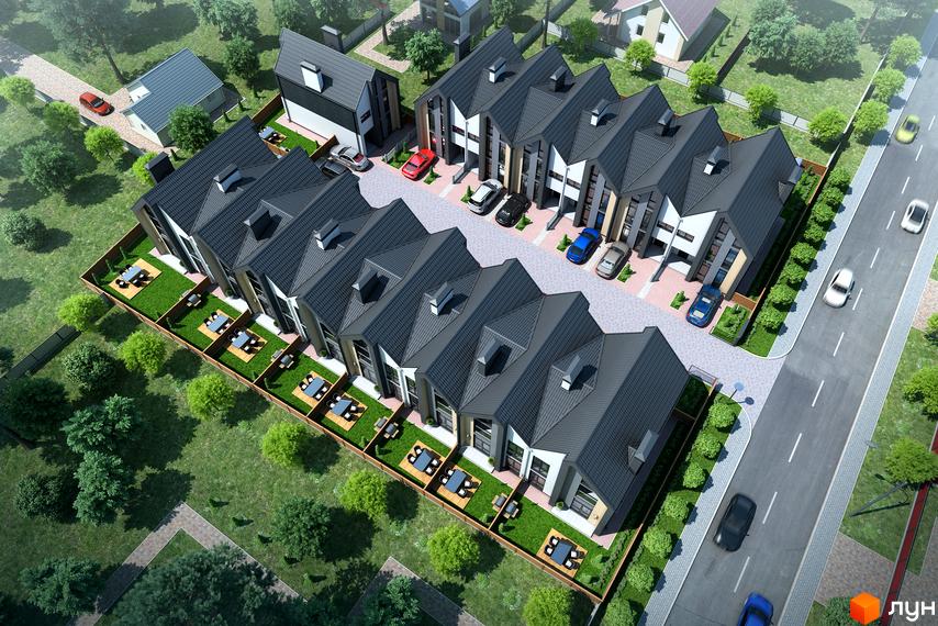 Зображення Котеджного містечка Oscar з виглядом на таунхауси з темними дахами та невеликими подвір'ями. Навколо зелені насадження та дорога.