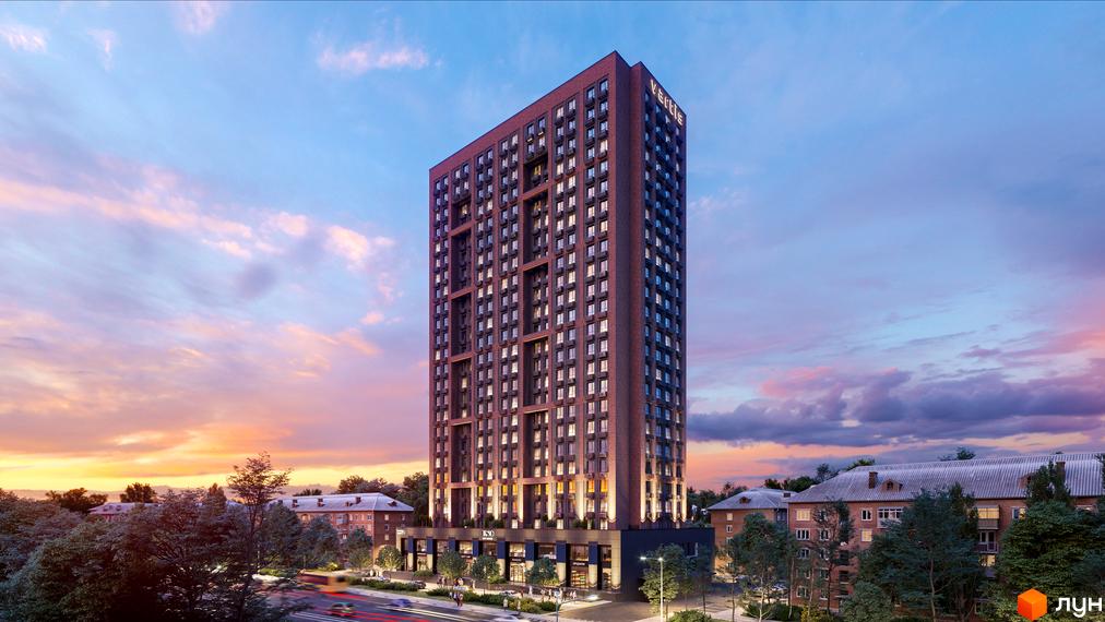 Вид на висотний житловий комплекс UNO City House з цегляним фасадом та численними вікнами. Навколо будівлі зелені дерева та міський пейзаж з дорогою та автомобілями.