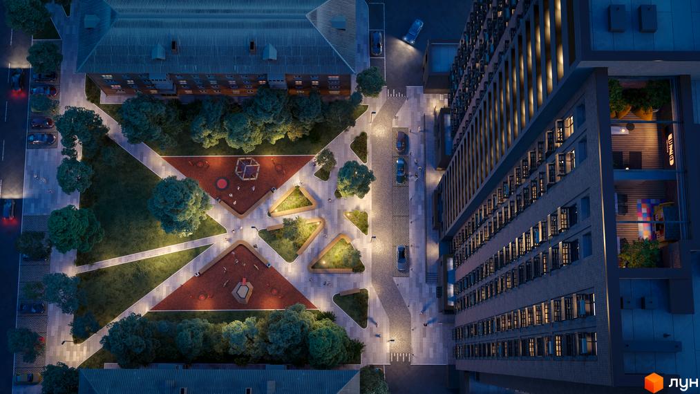 Комплекс UNO City House з фасадом з цегли та численними вікнами, що виходять на облаштований двір з дитячими майданчиками та зонами відпочинку.