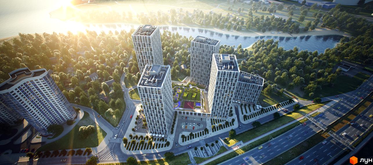 Вид на житловий комплекс Славутич з повітря: висотні будинки з геометричним фасадом та прибудинкова територія з зеленими зонами та дорогою.