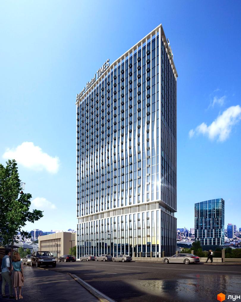 Фасад Апарт-комплексу Times з білими вертикальними лініями та скляними вікнами. Перед будинком проїжджа частина з автомобілями та пішоходами.