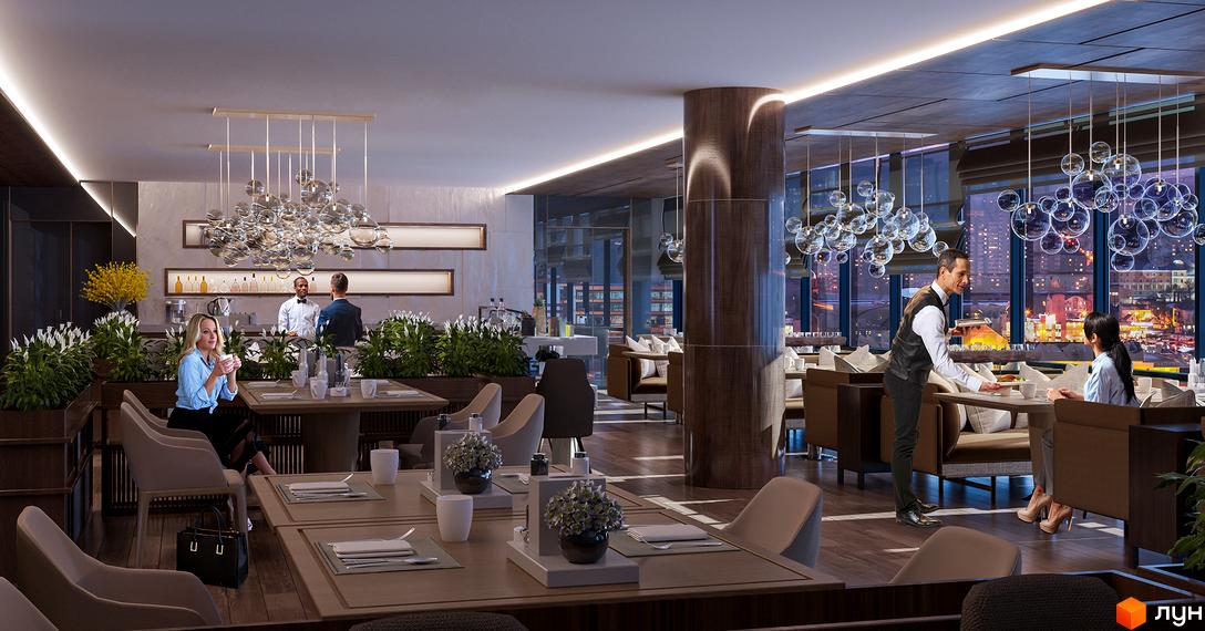 Ресторан у Комплексі Times з панорамними вікнами та видом на нічне місто, де відвідувачі насолоджуються їжею.