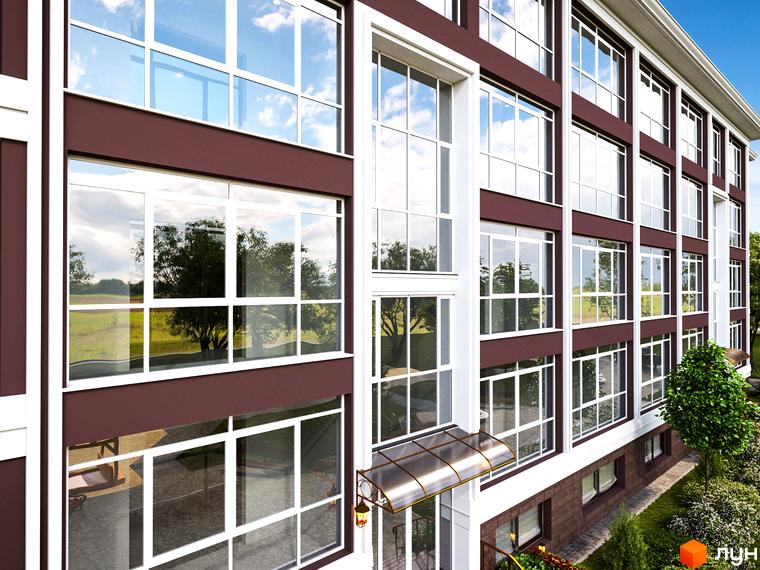 Житловий комплекс Олсія з великими вікнами та прибудинковою територією, озелененою деревами та кущами.