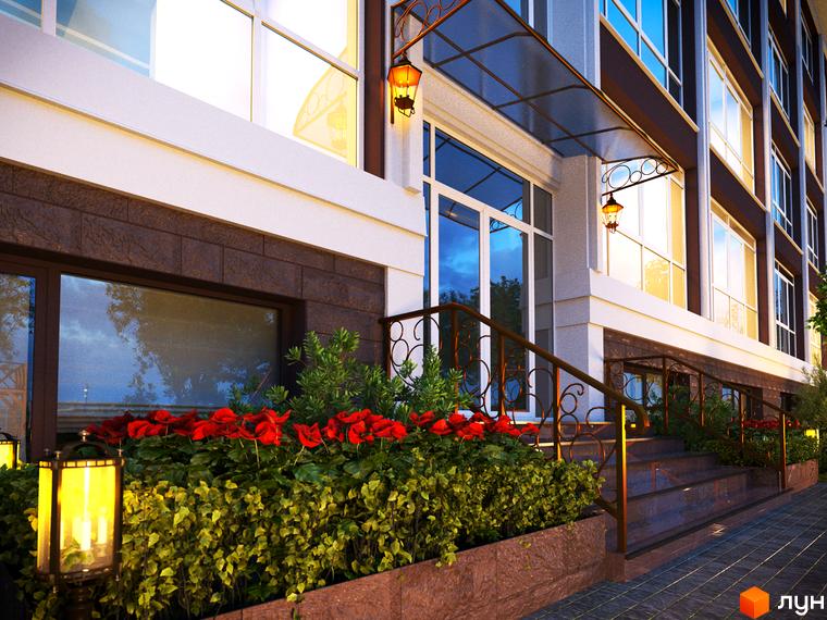 Клубний будинок „Олсія“ з червоними квітами та зеленими насадженнями біля входу. Зовнішній вигляд будівлі з великими вікнами та декоративними ліхтарями.