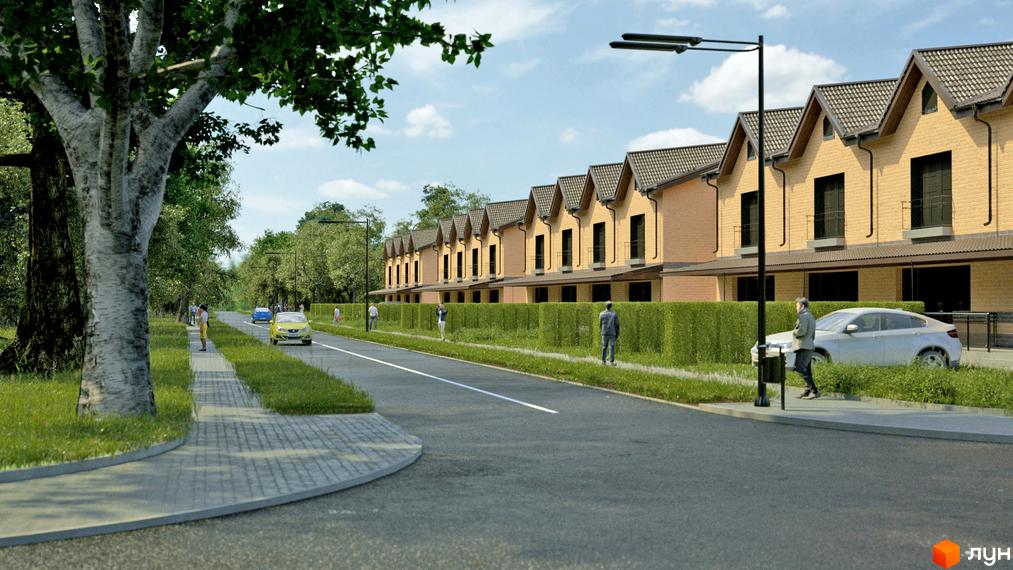 Таунхауси „Європейський квартал“ з бежевими фасадами та темними дахами, розташовані вздовж вулиці з тротуаром та зеленими насадженнями.