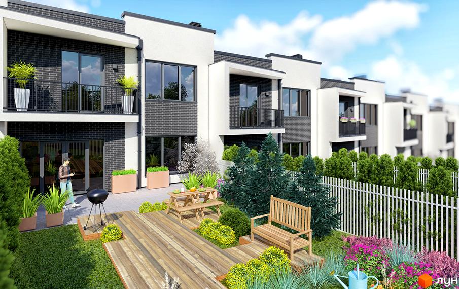 Таунхауси Rubicon Cottages з цегляним фасадом та балконами, з прибудинковою територією з дерев'яною терасою, лавкою та зеленими насадженнями.