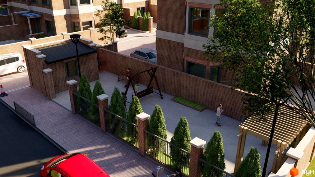 Вигляд на Таунхауси „Теремки“ з цегляними будівлями та внутрішнім двором, де розташовані дитячий майданчик і зелені насадження.