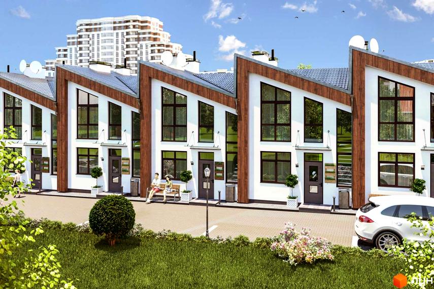 Ряд білих таунхаусів Apple House з похилими дахами та великими вікнами. Перед будинками зелений газон, доріжка та припаркований автомобіль.