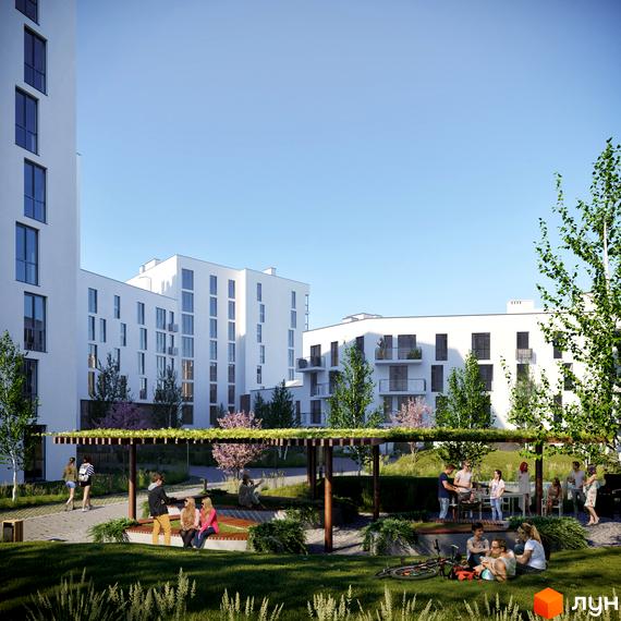 Житловий комплекс Малоголосківські пагорби. Сучасні білі будинки з балконами та великими вікнами, зелена прибудинкова територія з місцями для відпочинку та зонами для барбекю.