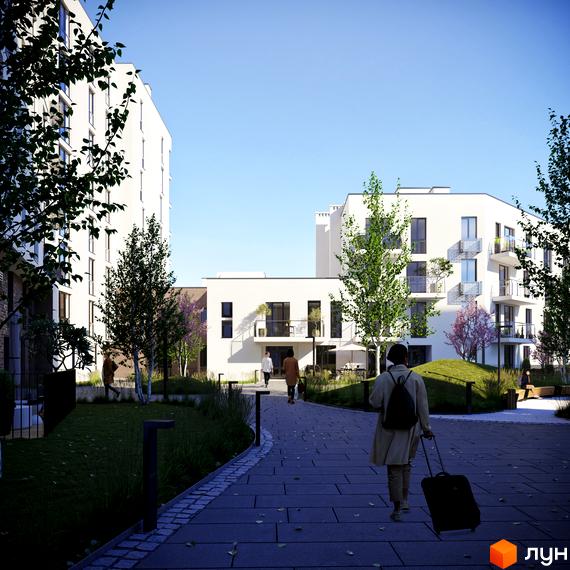 Житловий комплекс Малоголосківські пагорби з білими фасадами та зеленими зонами. На зображенні видно доглянуту прибудинкову територію з доріжками та деревами.