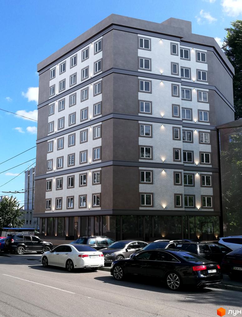 Багатоповерховий будинок з великою кількістю вікон та скляним фасадом на першому поверсі. Біля будинку припарковані автомобілі.