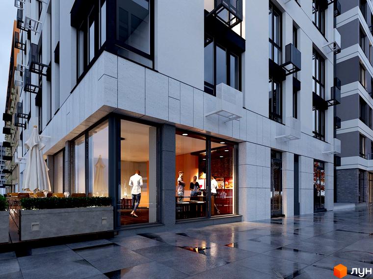 Зовнішній вигляд будівлі житлового комплексу Файна Таун з великими вікнами та терасою. На передньому плані мокрий тротуар.