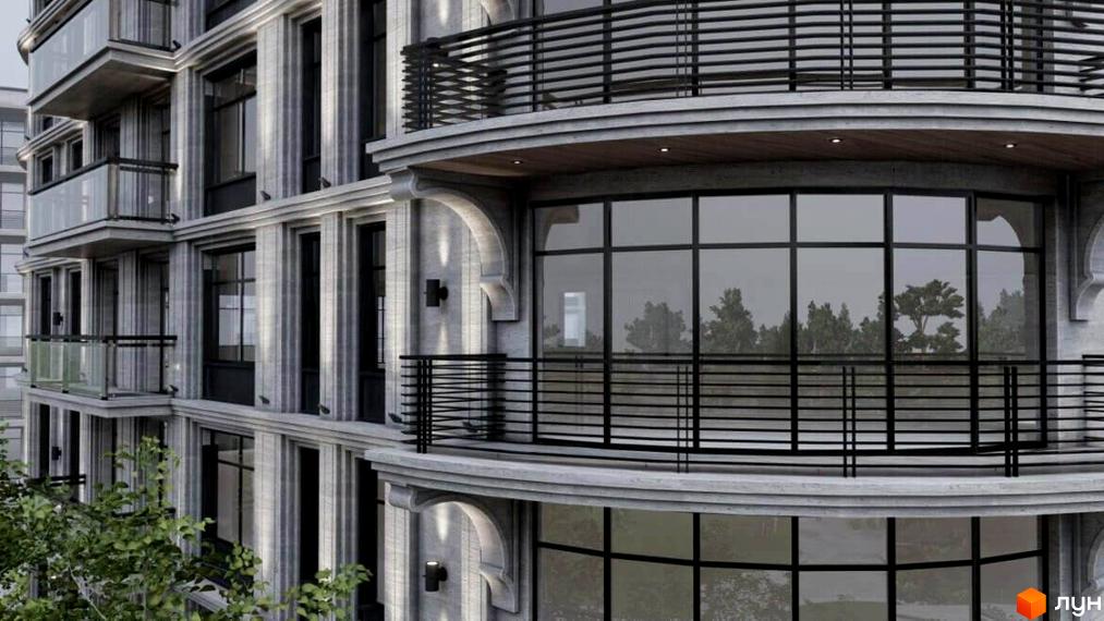 Фасад Житлового комплексу Лідерсівський з сірого каменю, великими вікнами та вигнутими балконами з чорними поручнями. Поруч видніються дерева.