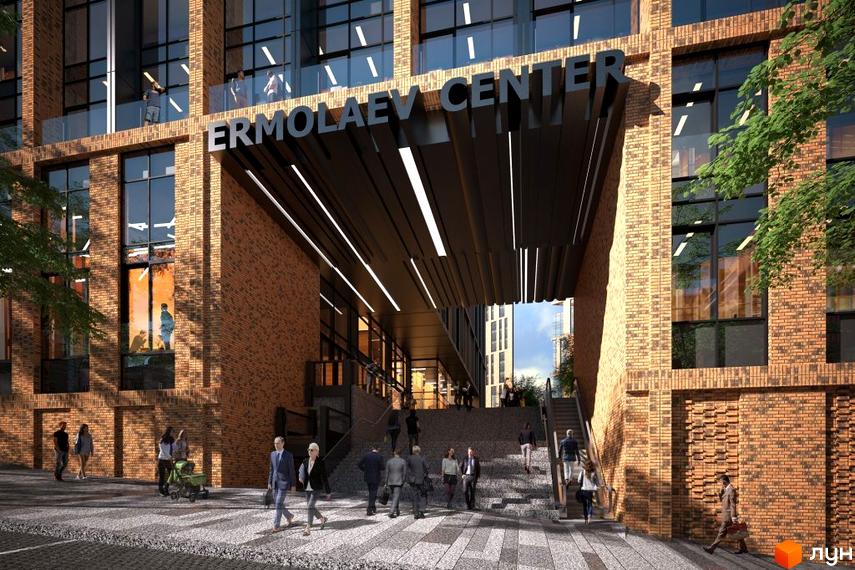 Комплекс Ermolaev Center з цегляним фасадом та великими вікнами. Перед входом розташовані сходи та пішохідна зона з людьми.