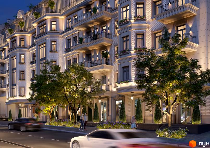 Клубний будинок „Консул“ з білою цегляною фасадою, балконами та освітленням. Навколо будинку дерева та квіти.