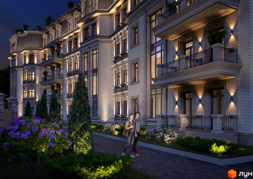 Клубний будинок „Консул“ з елегантною архітектурою та балконами, освітлений ввечері. Навколо будинку доглянута прибудинкова територія з квітами та деревами.