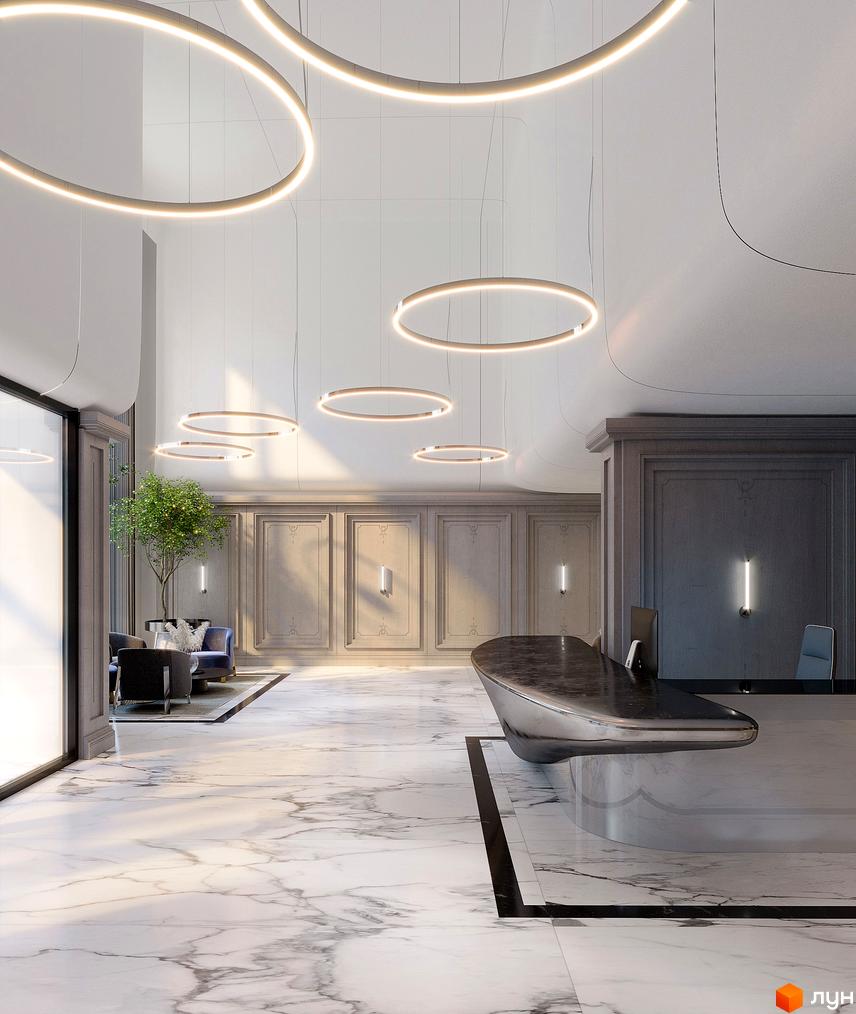 Інтер'єр холу житлового комплексу Creator City з дизайнерськими кільцевими світильниками та мармуровою підлогою. Сучасне оздоблення стін та елегантні меблі створюють атмосферу розкоші.