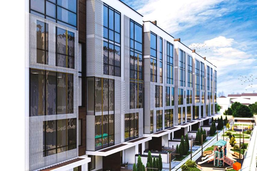 Зовнішній вигляд новобудови ЖК Sunrise City з великими вікнами та сітчастими фасадами. Поруч розташований дитячий майданчик та зелена зона.