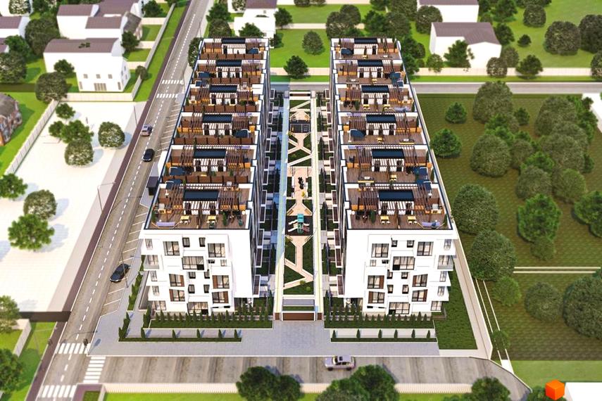 Житловий комплекс Sunrise City з білими фасадами, численними балконами та зеленою прибудинковою територією. На зображенні видно сучасну архітектуру та облаштований внутрішній двір.