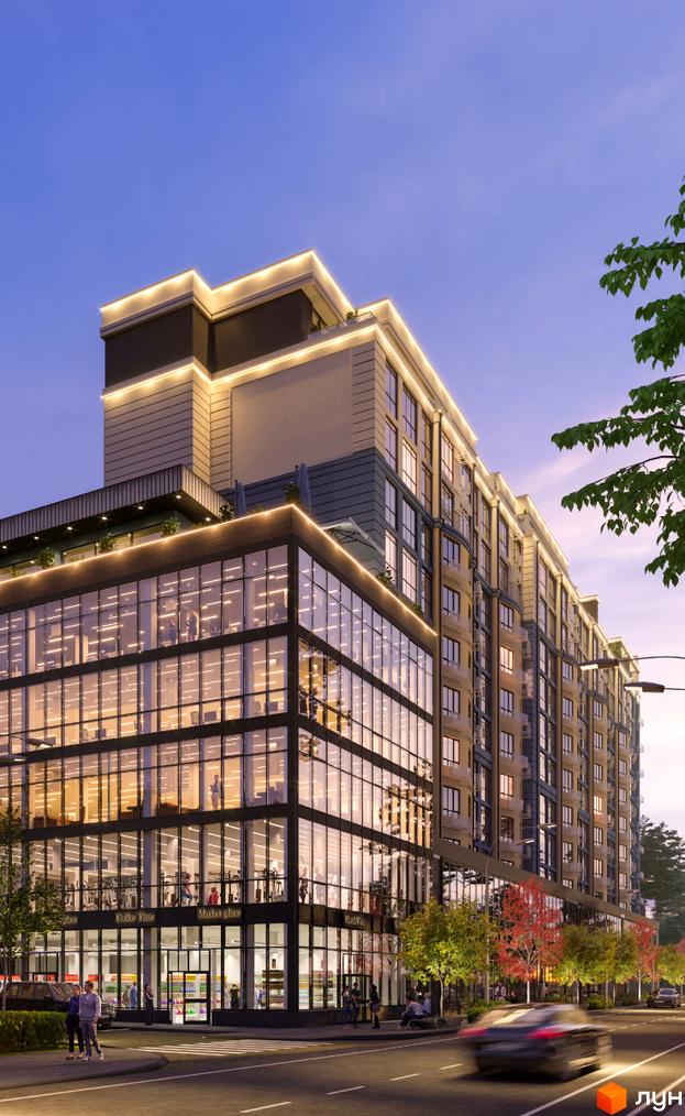 Багатоповерхова будівля ЖК Royal Park з панорамними вікнами та підсвіткою. На першому поверсі розташовані магазини, перед будинком дорога та дерева.