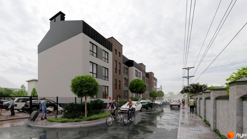 Житловий комплекс Вілла Валенсія. Фасад будинку з різнокольоровими елементами, вікнами та балконами, поруч дорога з автомобілями та пішохідна доріжка.