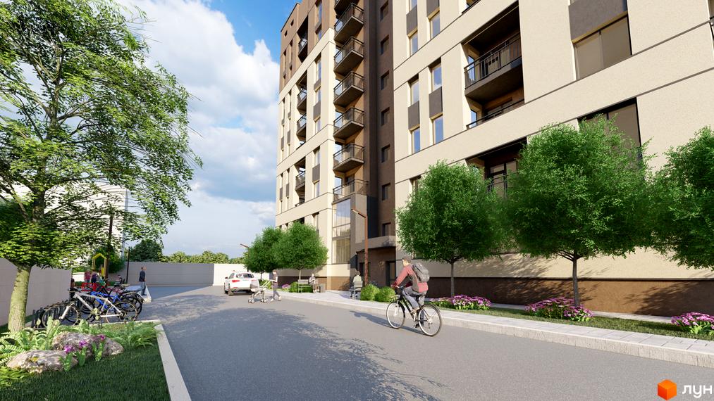 Житловий комплекс NIKOSTAR Comfort+ з фасадом світло-бежевого кольору та балконами, поруч зелені дерева та доріжка з велосипедами.