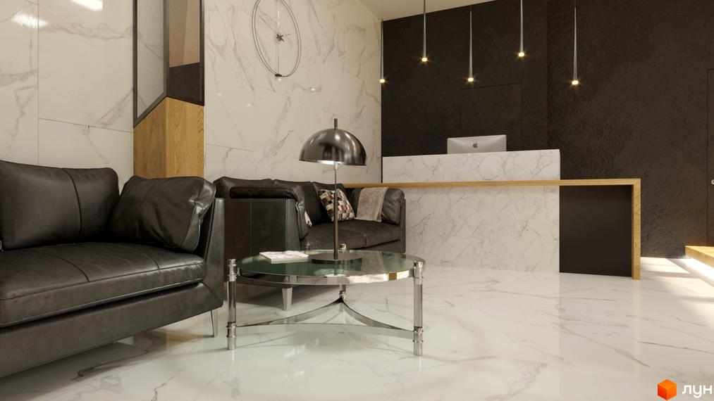 Інтер'єр холу Житлового комплексу Favorit: шкіряні дивани, скляний столик, стіни з мармуру, підвісні світильники. Просторий та світлий простір.
