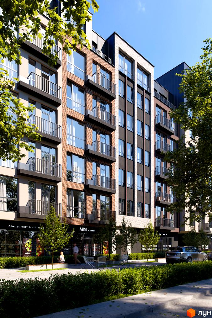 Зовнішній вигляд житлового комплексу Avalon Yard з цегляними та темними фасадами, балконами та великими вікнами. На прибудинковій території зелені насадження та магазини.