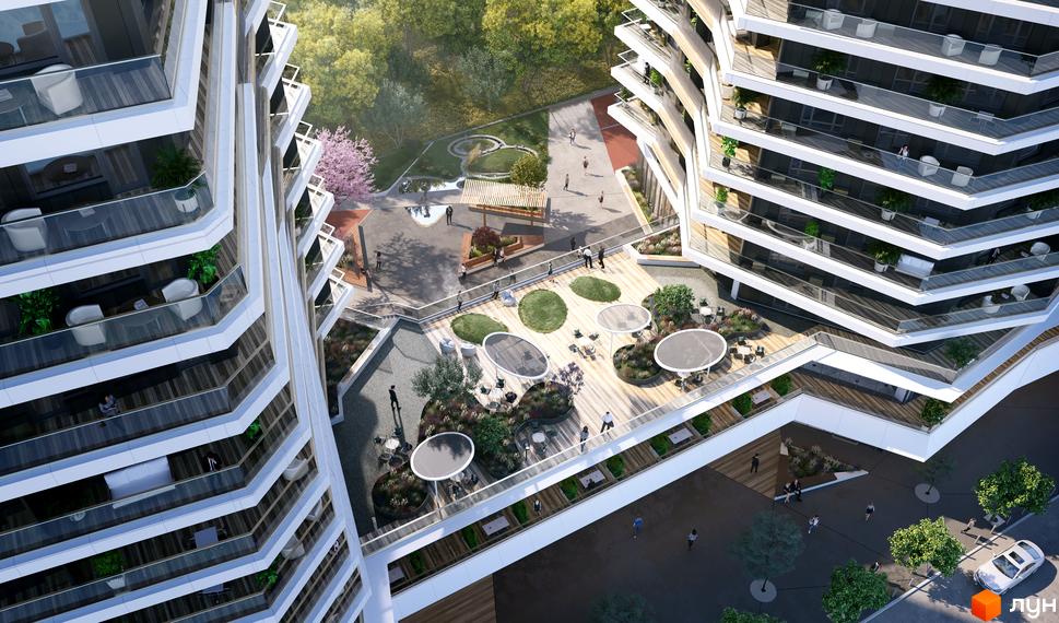 Вид зверху на житловий комплекс Diadans з багатоповерховими будівлями та терасами. На прибудинковій території розташовані зелені зони та місця для відпочинку.