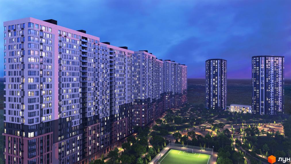 Високі будинки ЖК Star City з великою кількістю вікон, прибудинкова територія з зеленими насадженнями, спортивним майданчиком та освітленням.