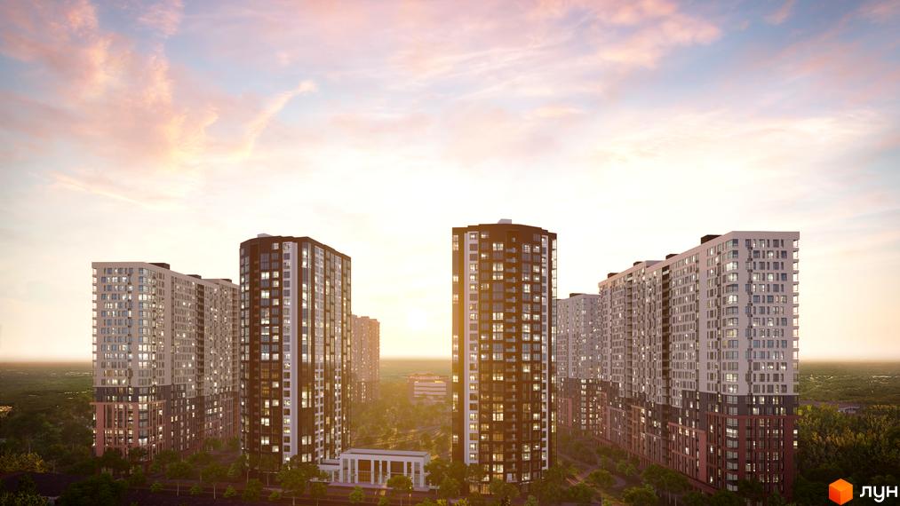 Зовнішній вигляд житлового комплексу Star City з високими будинками та зеленими насадженнями навколо. Фото новобудови на заході сонця.