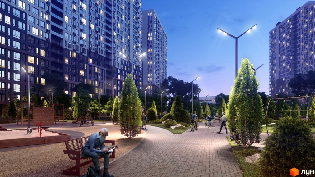 Житловий комплекс Star City з сучасними багатоповерхівками та доглянутою прибудинковою територією з алеями, дитячим майданчиком та зеленими насадженнями.