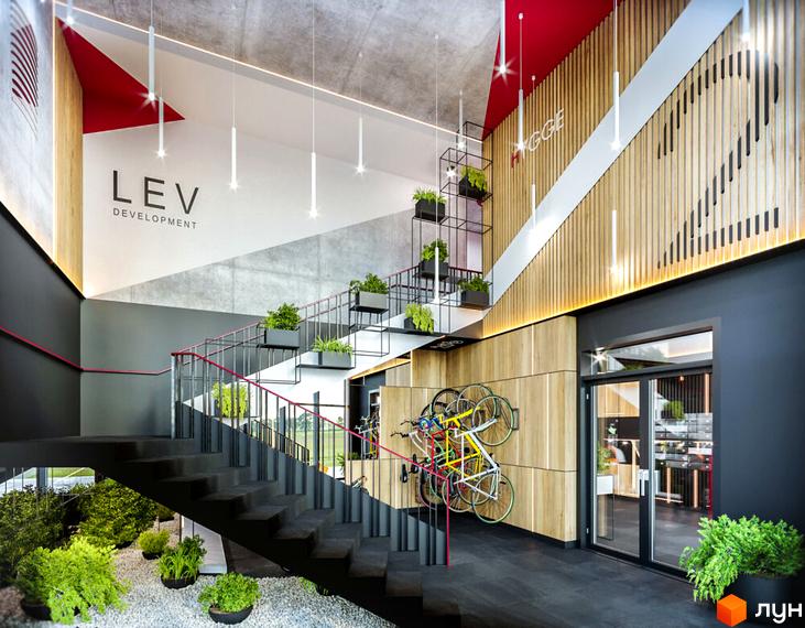 Інтер'єр лобі Житлового комплексу HYGGE з багатоярусними сходами, дерев'яними та бетонними стінами. Приміщення прикрашене зеленими рослинами та має місце для велосипедів.