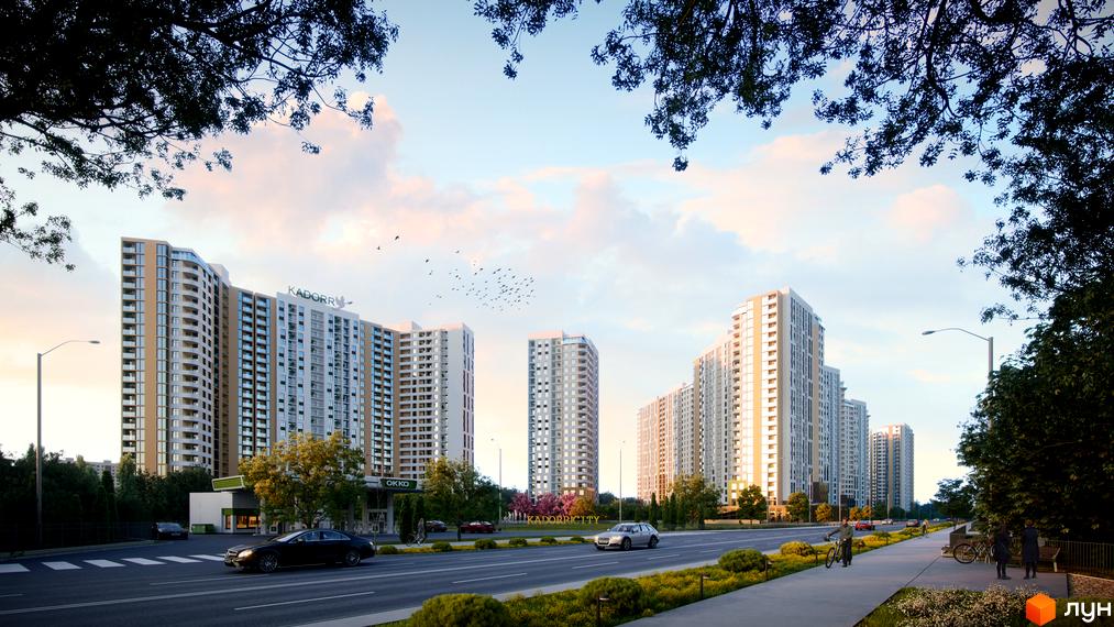Житловий комплекс KADORR City з високими будівлями та балконами. Навколо комплексу зелені насадження та дорога з автомобілями.