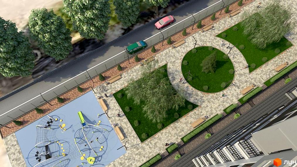 Житловий комплекс KromaxBud: вид зверху на територію з дитячим майданчиком, зонами відпочинку та зеленими насадженнями. Поруч дорога з автомобілями та парканом.