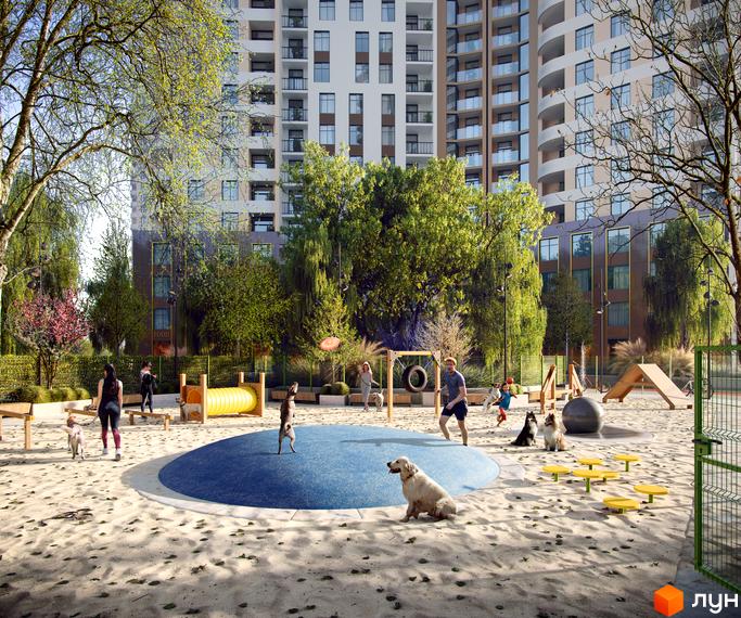 Житловий комплекс KADORR City з багатоповерховими будинками та облаштованим майданчиком для вигулу собак.