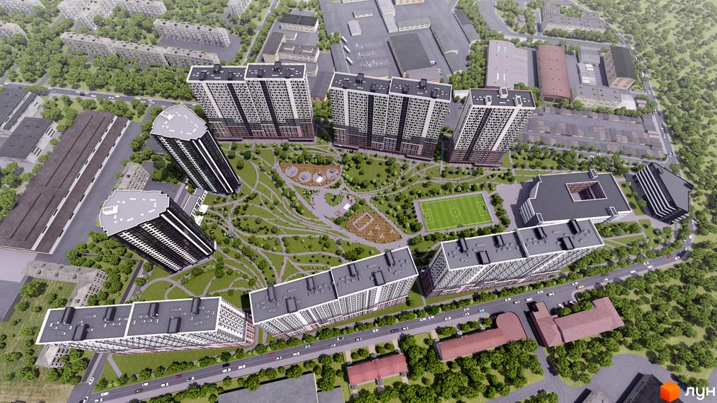 Вид зверху на житловий комплекс Star City з високими будинками та упорядкованою прибудинковою територією з зеленими зонами та спортивними майданчиками.