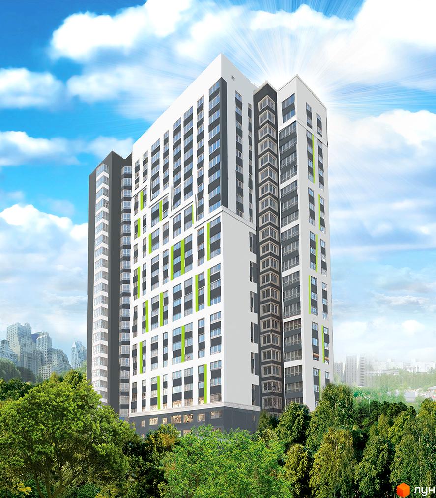 Новобудова ЖК Лук'янівський з біло-сірим фасадом та зеленими акцентами на фоні блакитного неба з хмарами. Навколо комплексу розташовані зелені дерева та міський пейзаж.