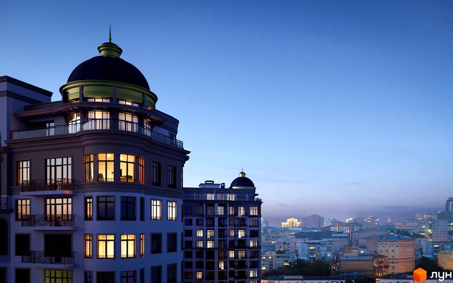 Житловий комплекс 52 Перлина (Pechersk Plaza) з куполоподібним дахом ввечері. Навколо видно вогні міста.