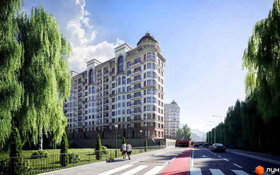 Житловий комплекс 52 Перлина (Pechersk Plaza) з архітектурою у класичному стилі. На передньому плані тротуар з пішоходами та зелені насадження.