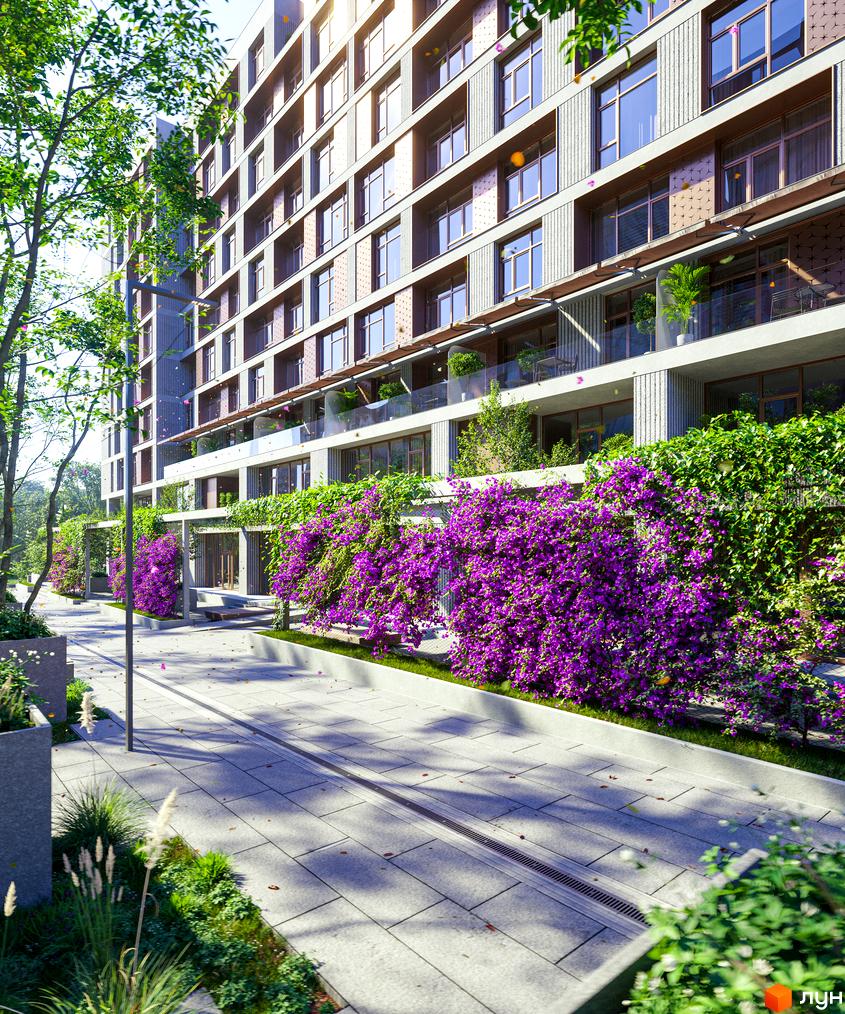 Клубний будинок К12 з фіолетовими квітами на фасаді та доглянутою прибудинковою територією. Зелені насадження та сучасна архітектура створюють затишний простір.